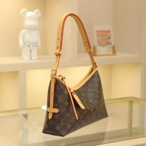 Alternative view of The CarryAll EastWest handbag, crafted from Monogram canvas with leather trim, makes the perfect companion for urban living. Its spacious silhouette features a neatly organized interior, enhanced by a large inner pocket for added functionality. The Monogram canvas zippered clutch is secured with a leather strap.